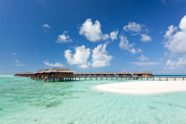 istock overwater bungalows in tropical lagoon 165883900