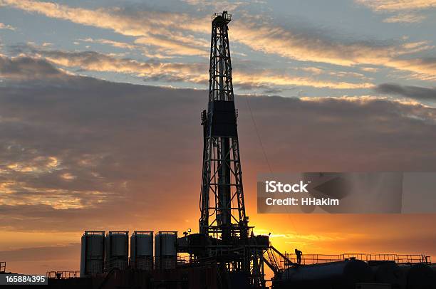 Drilling Rig Silhouette Stock Photo - Download Image Now - Back Lit, Construction Site, Crude Oil