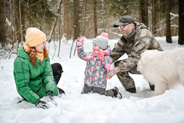 istock family walking in the winter forest 1658846717
