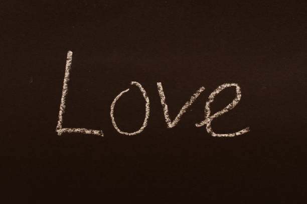 istock The word love is written in chalk on a black board. 1658849993
