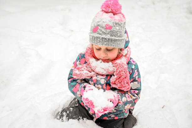 istock girl walking in the winter forest 1658853273