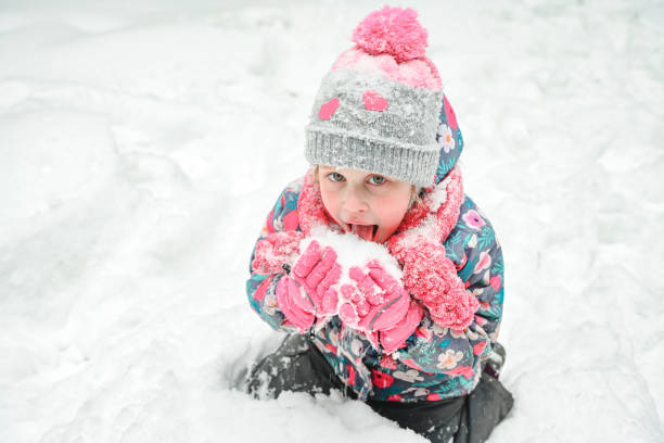 istock girl walking in the winter forest 1658854860