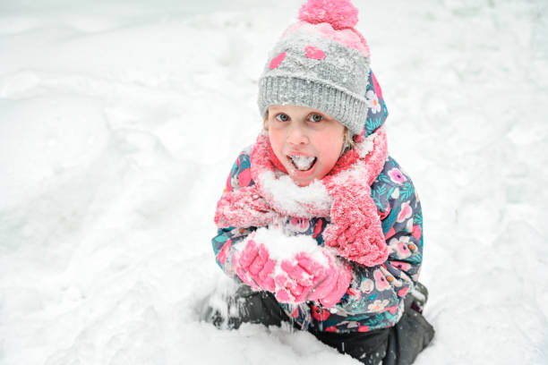 girl walking in the winter forest stock photo