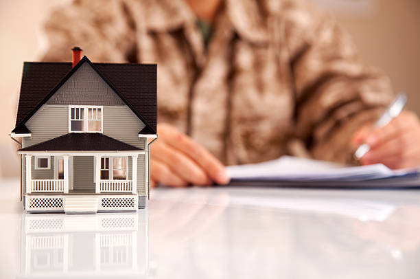 istock Marines Uniformed Personel with Real Estate Paperwork 165886316