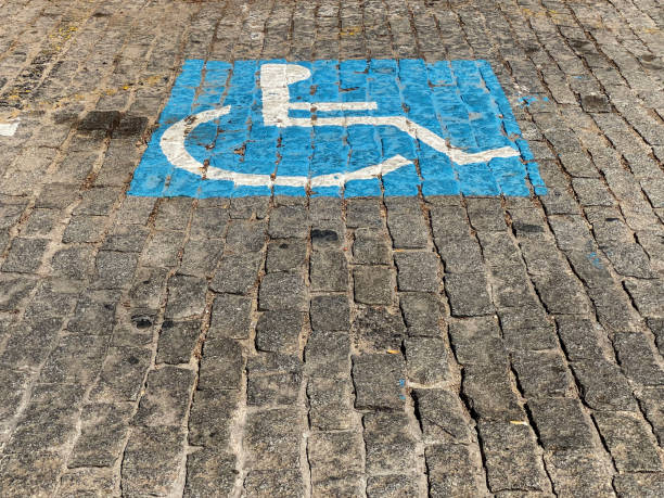 istock Parking sign for handicapped drivers over cobblestone 1658867474