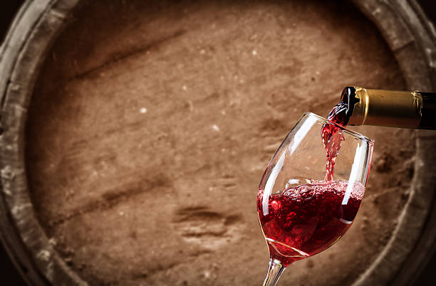 赤ワイングラスに注が - wine bottle composition cellar red wine ストックフォトと画像