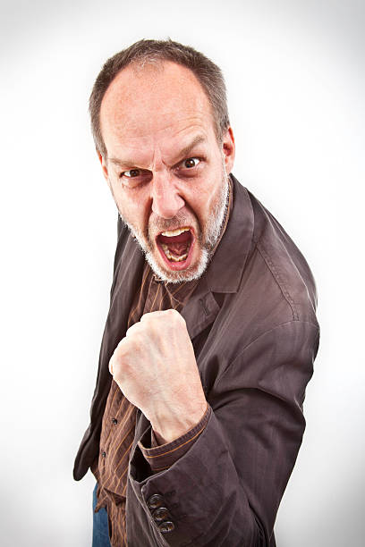 istock Angry man with 5 o'clock shadow and  raised fist 165891232
