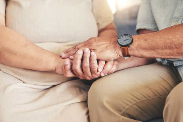 istock Retirement, holding hands or old couple for hope, support or loyalty in marriage commitment at home. Zoom, comfort or senior man bonding to relax with an elderly woman on anniversary for love or care 1658914259
