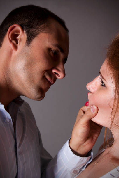 istock Man Pinching and Puckering Her Mouth 165891607
