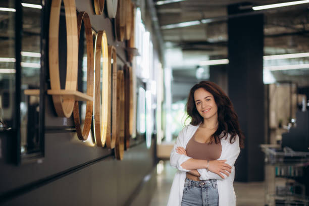 istock a woman chooses a mirror at home in a store. 1658940195