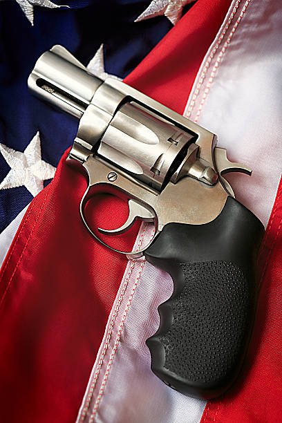 istock Gun on American Flag 165894615