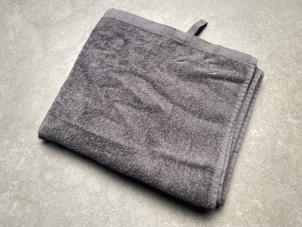 istock Gray color cotton towel on the granite tile background 1658949377