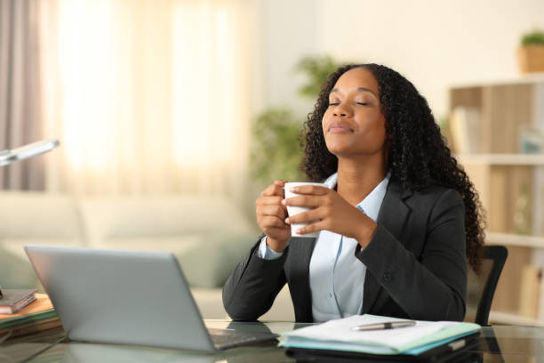 istock Black teleworker relieving stress breathing drinking coffee 1658964510