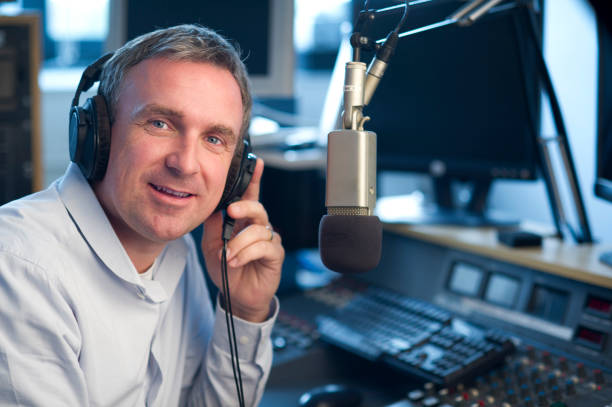 radio station presenter dj looks to camera radio dj stock pictures, royalty-free photos & images