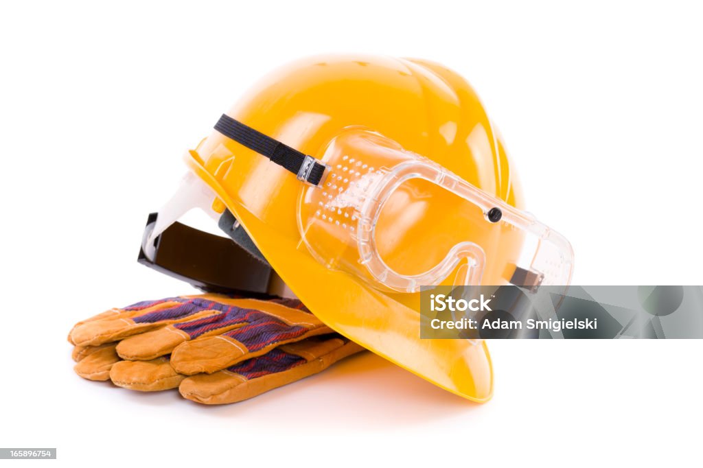 hard has construction hard hat with gloves and goggles Protective Eyewear Stock Photo