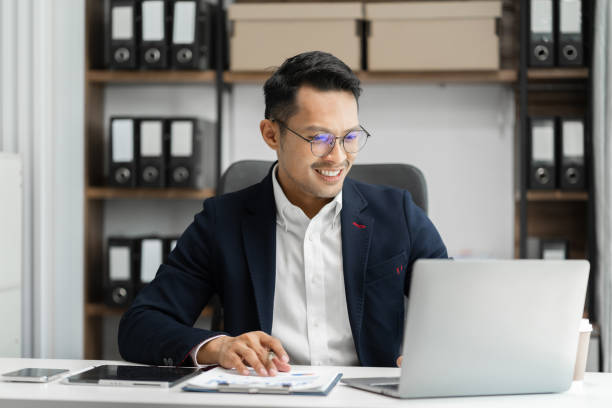 istock Business man working at office with laptop and documents on desk, financial adviser analyzing data. 1658970425