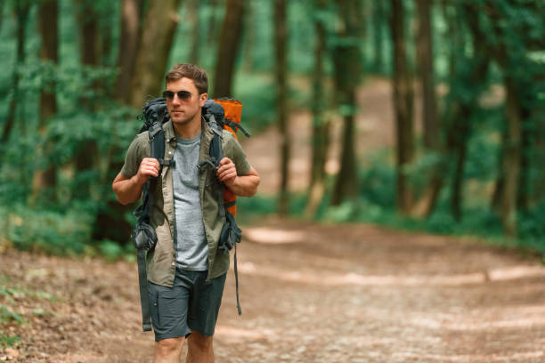 istock Tourist in summer forest. Conception of exploration and leisure 1658975498