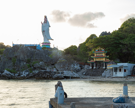 Landscape on Nghe Island with Lien Ton Pagoda and Guanyin Buddha statue facing the sea, Kien Giang province