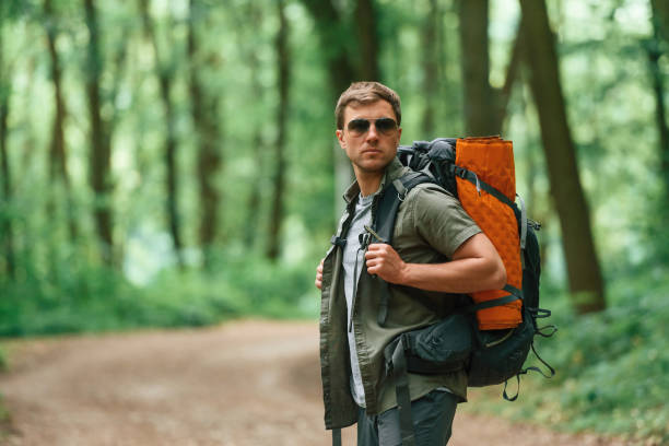 istock Tourist in summer forest. Conception of exploration and leisure 1658976061
