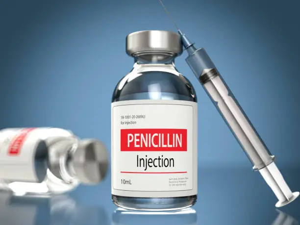 Photo of Penicillin Bottle with a Needle and Syringe