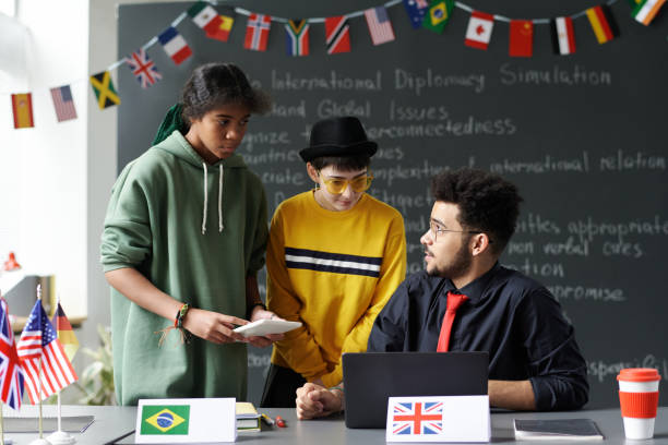 istock Students taking to teacher in the classroom 1658993865