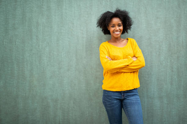 istock Attractive young african american woman standing with arms crossed 1658997607