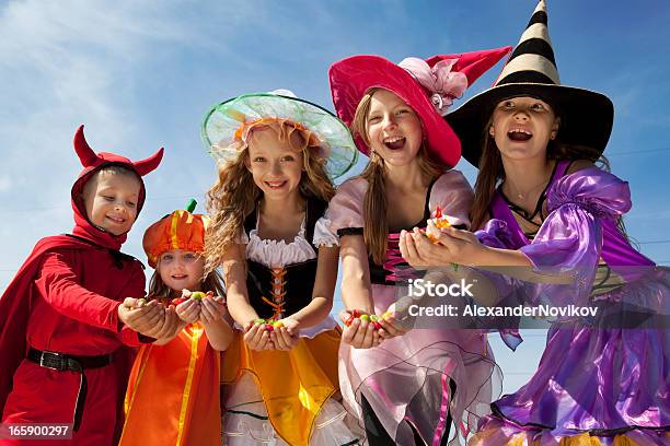 Five Halloween Children Holding Candies Stock Photo - Download Image Now - Child, Trick Or Treat, Bag