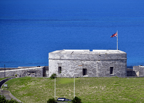 St. George's Island,  Bermuda: the Union Jack at Fort St. Catherine, coastal artillery fort at the North-East tip of St. George's Island, in the Imperial fortress colony of Bermuda - The first wooden fort was built on the site in 1612, the current structure dates mostly from the 19th century - Coot Pond Road - UNESCO World Heritage Site.