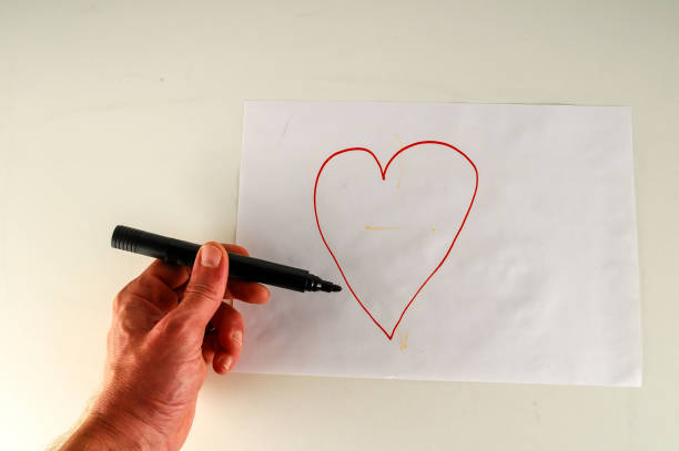 istock Close-up of sheet with drawing heart 1659017733