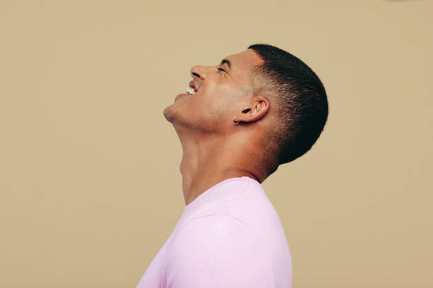 istock Young man smiling as he shows his beautiful radiant skin in a studio 1659034074