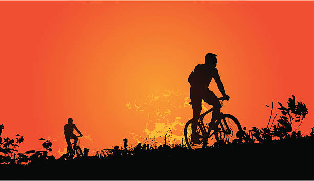 закат велосипедистов - mountain biking silhouette cycling bicycle stock illustrations