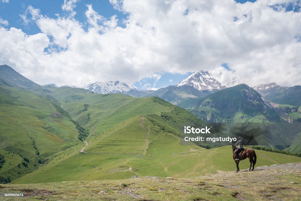 Georgian man with his horse in Caucasus mountains Georgia - Country Stock Photo