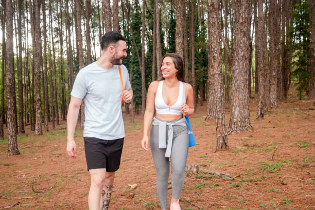 istock Couple exercising in a natural parkland. 1659044485