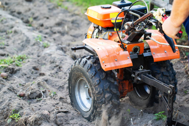istock A summer resident plows a garden with potatoes with a walk-behind tractor in the fall during the harvest. Copy space for text 1659044500
