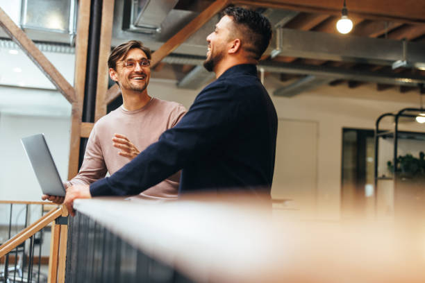 istock Male tech professionals having a discussion in an office 1659045569