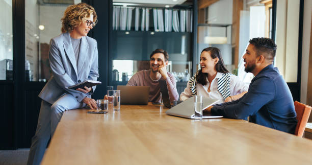 istock Group of tech professionals having a meeting in a boardroom 1659047713