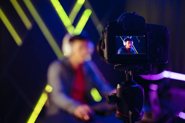 istock Creating gaming content, young male live streaming a video game with a camera 1659048287