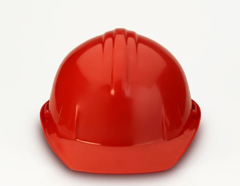A red constuction hard hat. Helmet