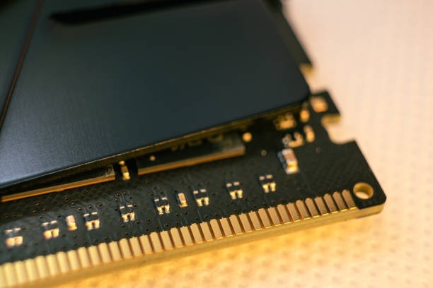 DDR4 DRAM memory module computer contacts macro DDR4 DRAM memory module golden electrical contact macro. Computer RAM chip close-up. Desktop PC memory for assemble motherboard ram slots stock pictures, royalty-free photos & images