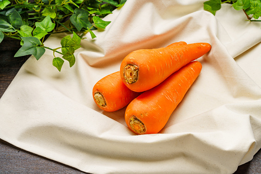 Fresh carrots on wooden table