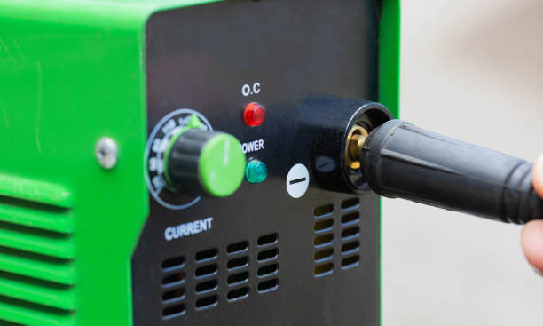 istock Adjusting the current strength on a modern welding machine. Welding arc. Close-up 1659058492