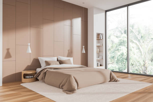istock Beige bedroom interior with bed and decoration, panoramic window 1659060115