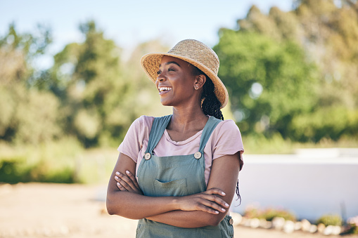 Thinking, black woman and farmer with arms crossed, happy and sustainability outdoor. Idea, agriculture and confident person smile in nature, agro and eco friendly vision in summer garden countryside
