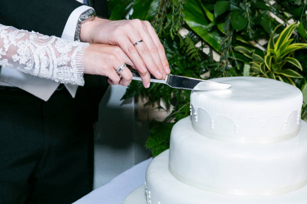 istock Newly Wed Couple; Hands With Wedding Rings. 1659087946