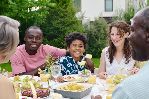 istock Happy African American boy sitting between his intercultural parents 1659093364