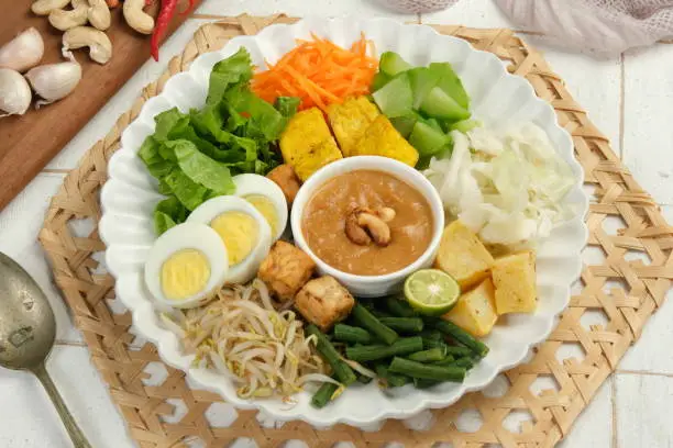 Photo of Gado Gado Indonesian Mix vegetables Salad from Boiled or Steam Vegetable Served with Peanut Sauce.
