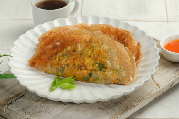 istock Martabak Telor or Martabak Telur. Savory pan-fried pastry stuffed with egg, meat and spices. Martabak Telur is one of Indonesia street food 1659106916