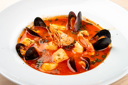 Spanish soup bouillabaisse with seafood, mussels, shrimps and scallop.