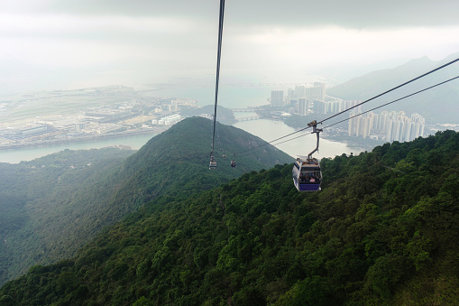 View from Nhong Ping 360 cable car crossing over the mountain in Tung Chung and Lantau Island at Hong Kong