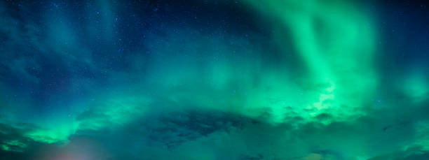 istock Bright and active Aurora borealis or Northern lights glowing in the night sky on Arctic circle 1659128962